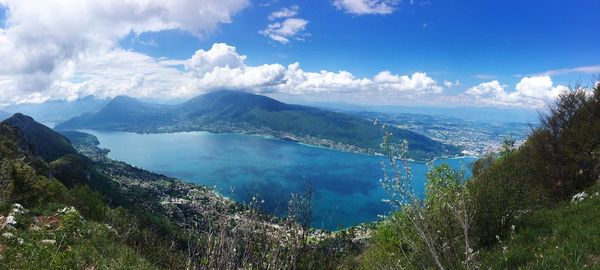 Panoramic view of sea and mountains against sky