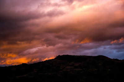 Low angle view of dramatic sky during sunset