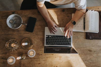 Woman's hands using laptop