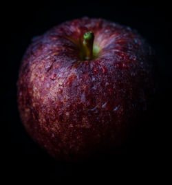 Close-up of apple against black background