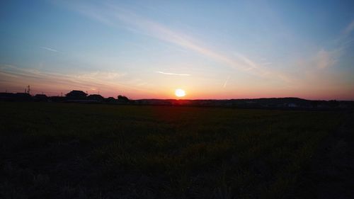 Scenic view of landscape at sunset