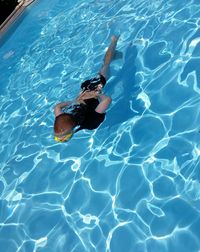 Woman swimming in pool