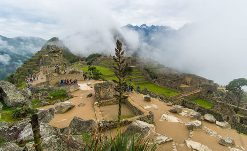 Scenic view of mountains against cloudy sky