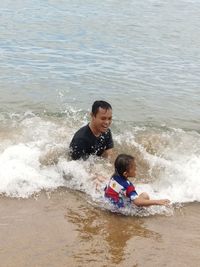Boy enjoying in sea