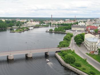 High angle view of bridge over river in city against sky