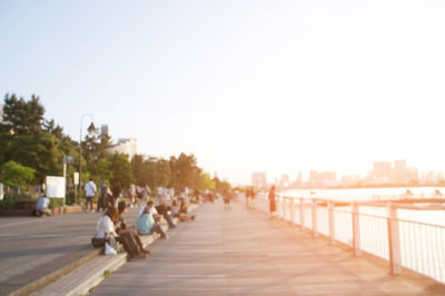 Rear view of people walking on pathway