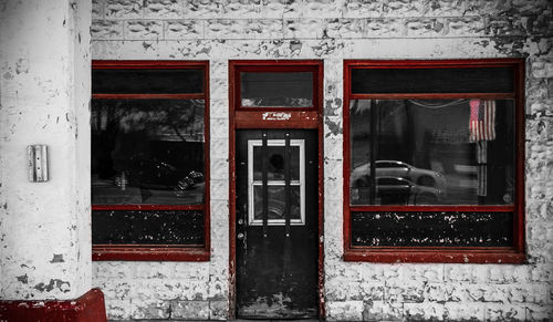 Reflection of building on glass window