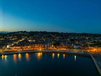 Aerial view of houses on broughty ferry shoreline after sunset