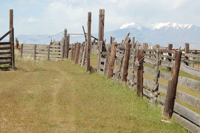 Built structure on field against cloudy sky
