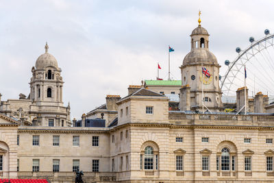 Low angle view of buildings in city against sky