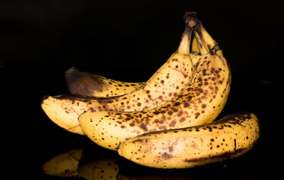 Close-up of bananas against black background