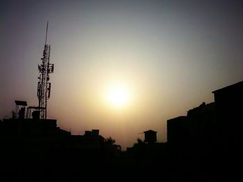 Low angle view of silhouette building against sky