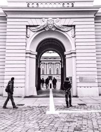 Group of people walking in corridor