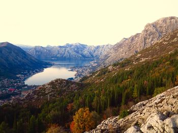 Scenic view of lake with mountain range in background