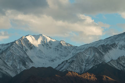 Scenic view of snowcapped mountains against sky