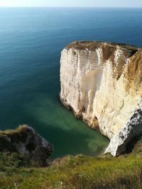 High angle view of rocks at sea shore