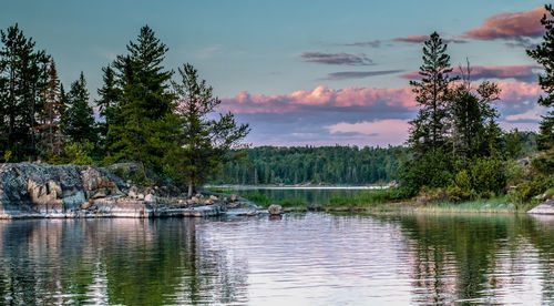 Scenic view of lake against cloudy sky