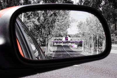 Reflection of car on side-view mirror