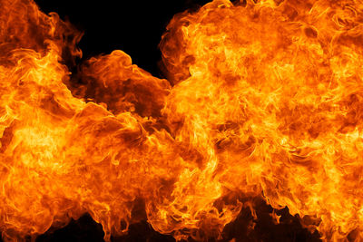 Close-up of fire against black background