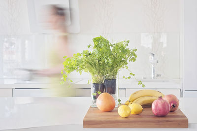 Quick cooking, healthy vegetarian food. fruits and herbs on clean table, pomegranate, lemons, herbs