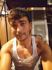 Portrait of shirtless man at home