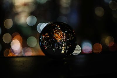 Close-up of crystal ball on street against 