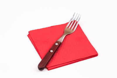 High angle view of red flag against white background