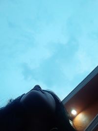 Low angle view of woman against sky