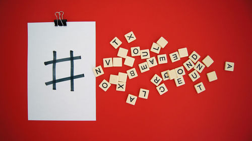 High angle view of information sign on red table