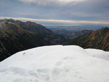 Scenic view of snowcapped mountains against sky