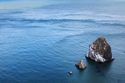 High angle view of rock formation in sea