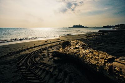 Scenic view of beach against sky during sunset