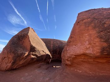 Low angle view of rock formations against sky