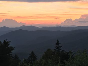 Scenic view of mountains against sky during sunset