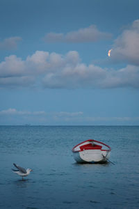 Boat in sea against sky