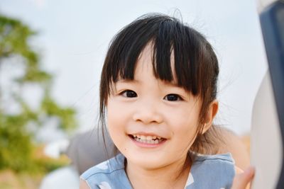 Close-up portrait of smiling girl