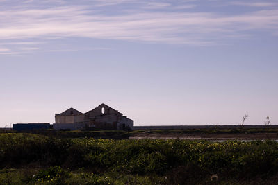 House on field against sky