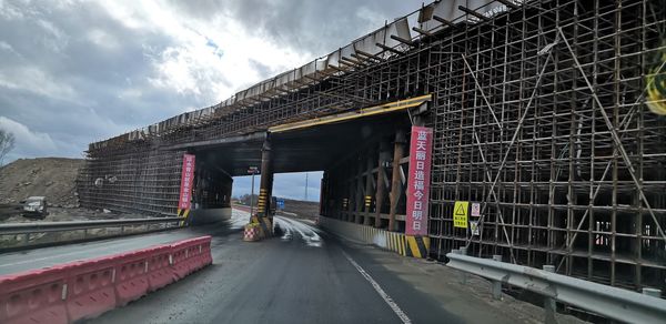 View of bridge against cloudy sky