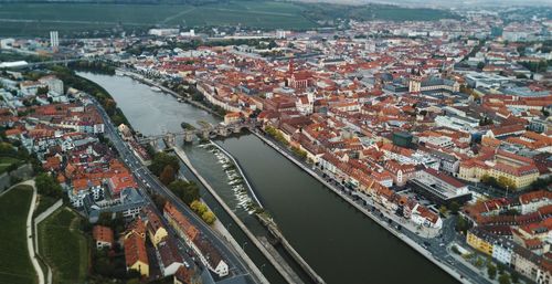 High angle view of river amidst cityscape