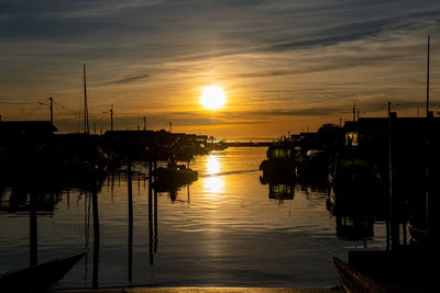 Silhouette of marina at sunset