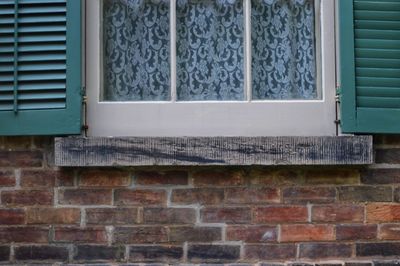 Close-up of window on wall of building