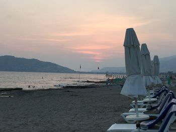 Scenic view of beach against sky during sunset