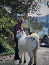 Full length of man with dog outdoors