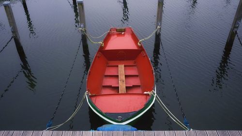 High angle view of boat moored by pier