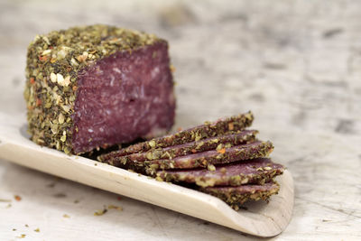 Close-up of salami on table