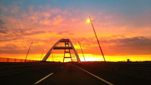 Highway against sky during sunset