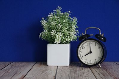 Close-up of alarm clock on table