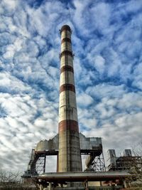 Low angle view of building against cloudy sky