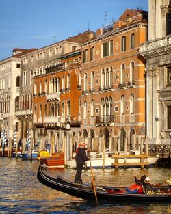 People on boat in canal