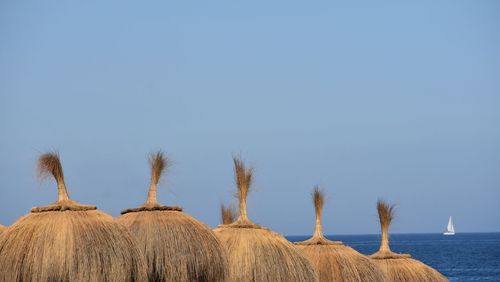 Panoramic view of water against clear blue sky